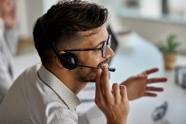 happy call center agent wearing headset while talking with clients working office 637285 6173